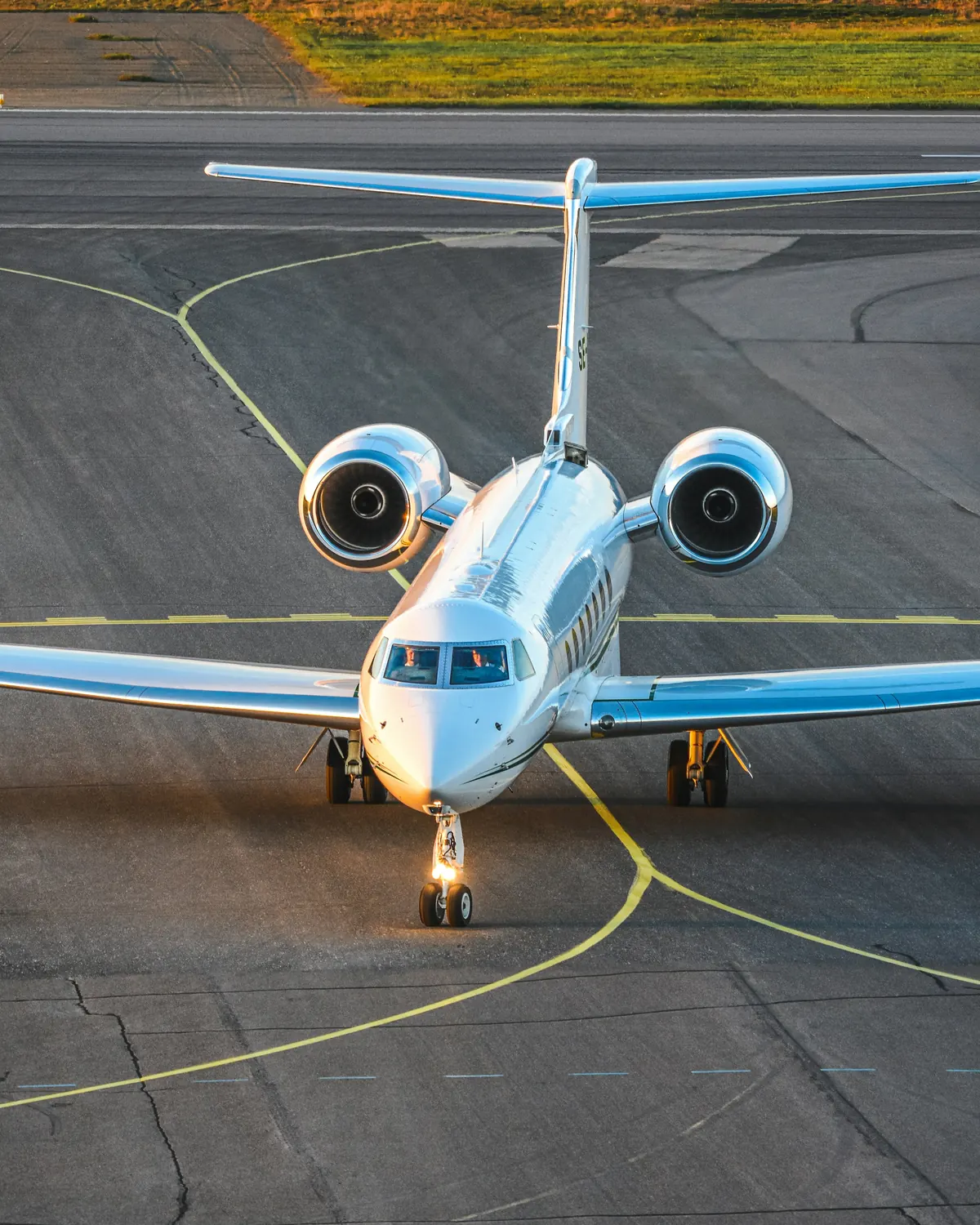 A business jet taxiing toward the camera